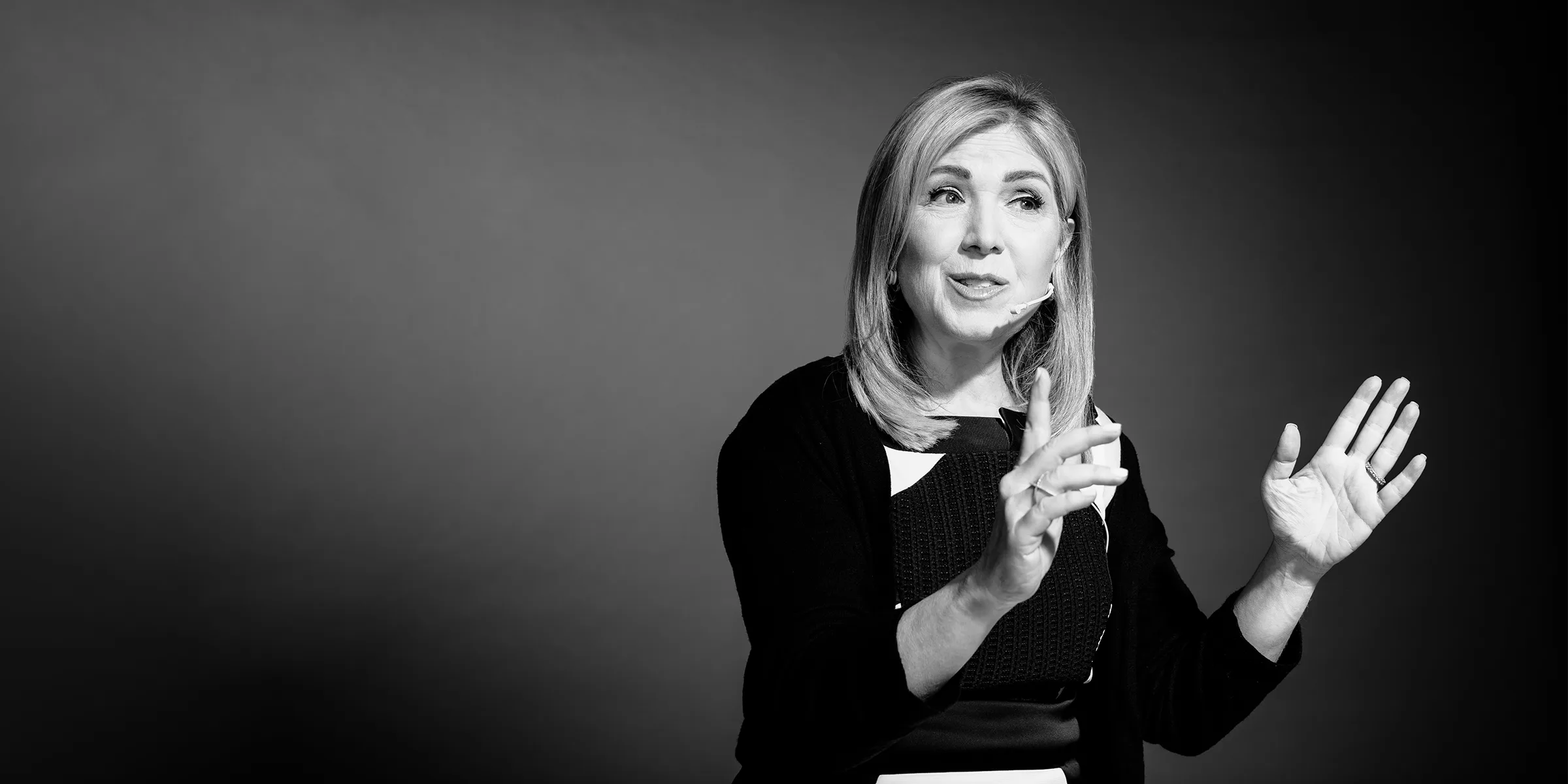 Leslie Zane speaking on stage